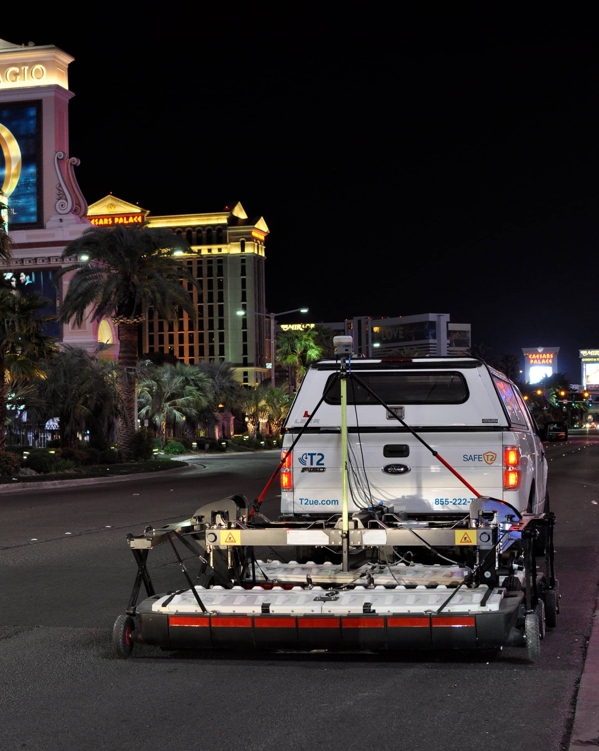 T2 Utility Engineers Pickup truck pulling an MCGPR scanner at night on the Las Vegas strip