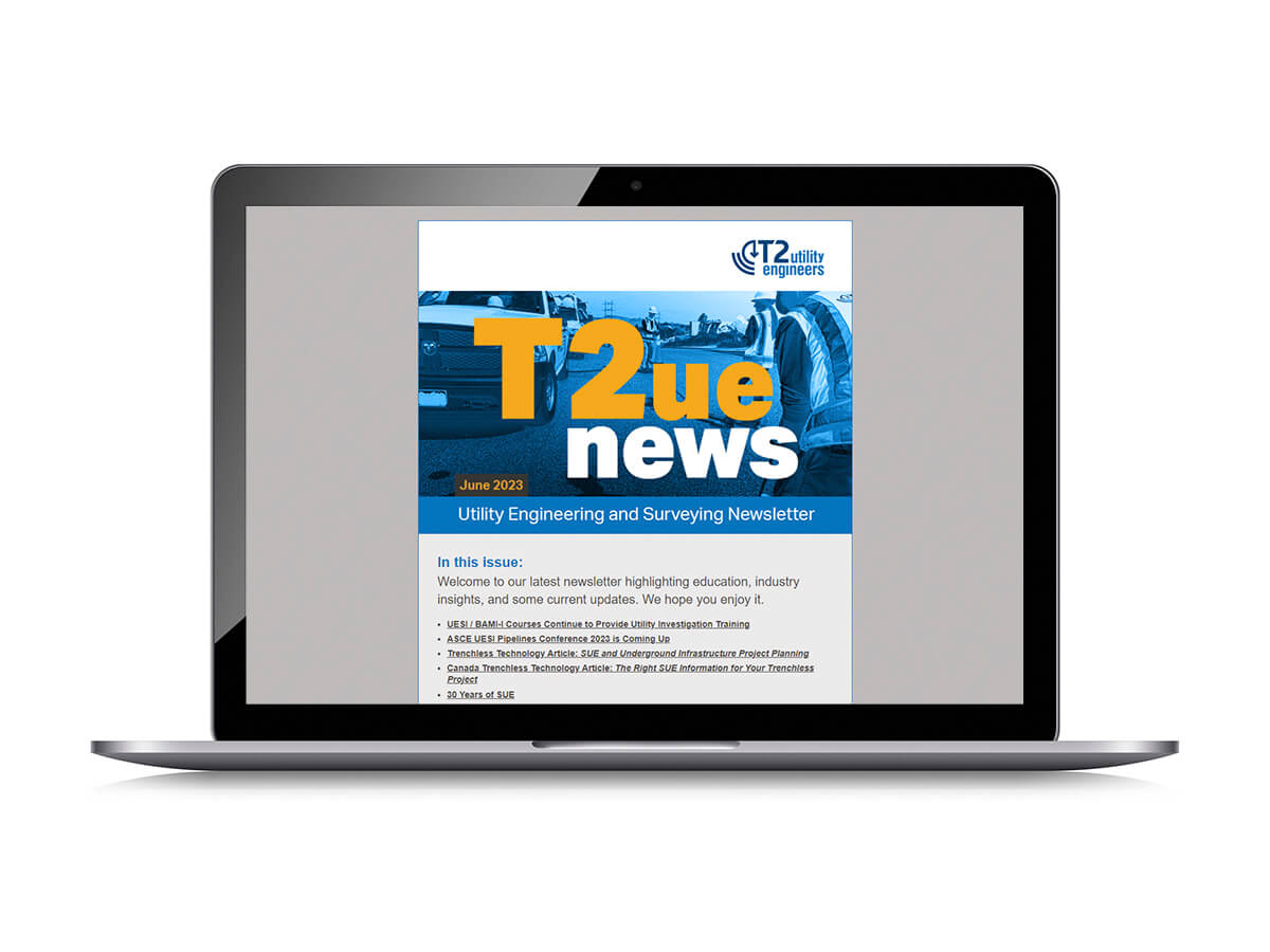 Laptop screen showing the cover of the T2ue Newsletter June 2023 edition